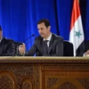 Tổng thống Syria Bashar al-Assad (giữa) chủ trì cuộc họp với các thành viên đảng Baath cầm quyền tại Damascus. (Ảnh: AFP/TTXVN)