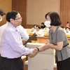 Thủ tướng Phạm Minh Chính và bà Vũ Việt Trang, Phó Tổng Giám đốc TTXVN. (Ảnh: Dương Giang/TTXVN)