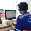 Nhân viên điều phối cấp cứu Tổng đài cấp cứu 115 đặt tại Công viên phần mềm Quang Trung. (Ảnh: Tiến Lực/TTXVN)