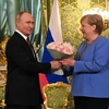 Tổng thống Nga Vladimir Putin (trái) và Thủ tướng Đức Angela Merkel (phải) tại cuộc gặp ở Moskva, Nga, ngày 20/8/2021. (Ảnh: AFP/TTXVN)