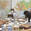 Phó Thủ tướng Vũ Đức Đam làm việc với lãnh đạo TP. Hồ Chí Minh về cung ứng hàng hóa thiết yếu cho người dân. (Ảnh: TTXVN phát)