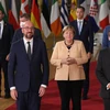 Thủ tướng Đức Angela Merkel (giữa) chụp ảnh chung cùng các nhà lãnh đạo EU tại hội nghị thượng đỉnh của khối ở Brussels, Bỉ ngày 21/10/2021. (Ảnh: AFP/TTXVN)
