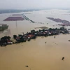 Cảnh ngập lụt sau những trận mưa lớn tại Bekasi, Tây Java, Indonesia, ngày 22/2/2021. (Ảnh: AFP/TTXVN)