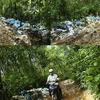 Rác thải ùn ứ cả hai bên đường dẫn vào bãi rác. (Nguồn: baoquangngai.vn)
