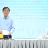 Thứ trưởng Bộ Lao động, Thương binh và Xã hội Nguyễn Bá Hoan trả lời báo chí tại buổi họp báo. (Ảnh: Minh Đức/TTXVN)