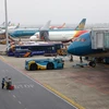 Máy bay của các hãng hàng không tại sân bay Nội Bài. (Ảnh: Huy Hùng/TTXVN)