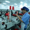 Sản xuất dệt nhuộm tại Công ty TNHH Dệt nhuộm Jasan Việt Nam có vốn đầu tư Trung Quốc (Khu công nghiệp dệt may Phố Nối B, Liêu Xá, Yên Mỹ, Hưng Yên). (Ảnh: Phạm Kiên/TTXVN)