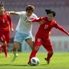 Đội tuyển nữ Việt Nam đã có chiến thắng nghẹt thở 2-1 ở trận play-off với tuyển nữ Đài Bắc Trung Hoa trên sân DY Patil, thành phố Navi Mumbai (Ấn Độ). (Ảnh: TTXVN phát)