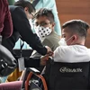 Tiêm vaccine ngừa COVID-19 cho trẻ vị thành niên tại Mexico City, Mexico ngày 25/10/2021. (Ảnh: AFP/TTXVN)