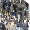 Người dân đeo khẩu trang phòng dịch COVID-19 tại Tokyo, Nhật Bản. (Ảnh: Kyodo/TTXVN)