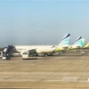 Máy bay của hãng hàng không Busan (Hàn Quốc) đang trả khách tại Sân bay Quốc tế Jeju. (Ảnh: Anh Nguyên/TTXVN)