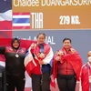 Các VĐV nhận huy chương hạng cân trên 71kg nữ: Duangaksorn Chaidee (Thái Lan, HCV), Akmal Nurul (Indonesia, HCB), VĐV Nguyễn Thị Kim Vân (Việt Nam, HCĐ). (Ảnh: Việt Cường/TTXVN)