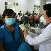 Tiêm vaccine COVID-19 cho người dân thành phố Vị Thanh, Hậu Giang. (Ảnh: Duy Khương/TTXVN)