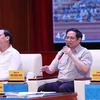 Thủ tướng Phạm Minh Chính đối thoại với công nhân lao động năm 2022. (Ảnh: Dương Giang/TTXVN)