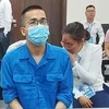 Bị cáo Hoàng Việt Trung (áo xanh) tại phiên tòa. (Nguồn: cand.com.vn)