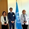 Trợ lý Bộ trưởng Bộ Ngoại giao Đỗ Hùng Việt (đứng giữa) trong cuộc gặp Tổng Giám đốc Văn phòng LHQ tại Geneva Tatiana Valovaya ngày 27/6. (Ảnh: Tố Uyên/PV TTXVN tại Geneva)