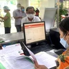 Người dân làm thủ tục hành chính tại Chi nhánh Văn phòng Đăng ký đất đai quận Gò Vấp (TP. HCM). (Ảnh: sggp.org.vn)