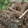 Nhà cửa bị phá hủy do mưa lũ ở tỉnh Nuristan, Afghanistan ngày 18/8/2022. (Ảnh: THX/TTXVN)