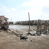 Sạt lở nghiêm trọng làm hư hỏng nhà của người dân ở khu vực Cồn Ngoài, Cồn Nhàn, xã Bảo Thuận, huyên Ba Tri. (Ảnh: Công Trí/TTXVN)