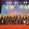 Đại biểu hai nước Việt Nam-Lào chụp ảnh lưu niệm tại lễ khai mạc. (Ảnh: Nguyên Linh/TTXVN)