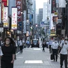 Người dân di chuyển trên phố tại Tokyo, Nhật Bản. (Ảnh: AFP/TTXVN)