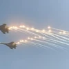 Màn biểu diễn của 2 máy bay Su-30MK2 thực hiện tại khu vực Sân Golf khu Tư Đình (quận Long Biên) Hà Nội sáng 3/11. (Ảnh: Trần Đạt/Vietnam+)