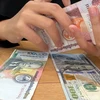 Ngân hàng Nhà nước Lào nỗ lực ổn định tỷ giá hối đoái
