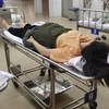 Chị Thư nằm chờ cấp cứu tại Bệnh viện Đa khoa khu vực Long Thành ngày 28/2. (Ảnh: Báo Lao động)