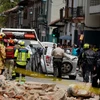 Một chiếc ôtô bị hư hỏng và đống đổ nát từ một ngôi nhà bị ảnh hưởng bởi trận động đất tại Cuenca, Ecuador, ngày 18 tháng 3 năm 2023. (Nguồn: Reuters)