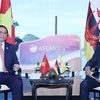 Thủ tướng Phạm Minh Chính gặp Quốc vương Brunei Hassanal Bolkiah. (Ảnh: Dương Giang/TTXVN)