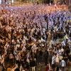 Người dân Israel tham gia biểu tình phản đối kế hoạch cải cách tư pháp, tại Tel Aviv. (Ảnh: AFP/TTXVN)