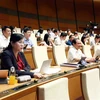 Đoàn đại biểu Quốc hội tỉnh Thái Nguyên biểu quyết thông qua Nghị quyết về Chương trình xây dựng luật, pháp lệnh năm 2024. (Ảnh: Phạm Kiên/TTXVN)