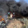 Người biểu tình Palestine phản đối việc binh sỹ quân đội Israel sát hại 5 người Palestine ở khu vực biên giới phía Đông Dải Gaza, ngày 19/6/2023. (Ảnh: THX/TTXVN)