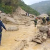 Nhân viên cứu hộ làm việc tại hiện trường vụ lở đất ở tỉnh Cundinamarca, Colombia . (Nguồn: AFP)