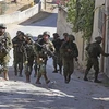 Dân quân Palestine đấu súng với binh sỹ Israel gần thành phố Nablus
