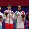 Võ sỹ Bạc Thị Khiêm (bìa phải) giành Huy chương Đồng môn Taekwondo, hạng cân 67 kg nữ tại tại ASIAD 2023 ở Hàng Châu, Trung Quốc, ngày 27/9/2023. (Ảnh: THX/TTXVN)