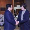 Thủ tướng Phạm Minh Chính thăm hỏi bà Akie Abe, Phu nhân cố Thủ tướng Nhật Bản Abe Shinzo. (Ảnh: Dương Giang/TTXVN)