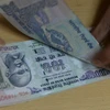 Đồng tiền mệnh giá 100 rupee của Ấn Độ. (Ảnh: AFP/ TTXVN)