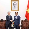 Phó Thủ tướng Trần Lưu Quang tiếp ông Yamada Junichi, Phó Chủ tịch điều hành cấp cao Cơ quan Hợp tác quốc tế Nhật Bản (JICA). (Ảnh: Doãn Tấn/TTXVN)