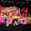Tiết mục "Liên khúc giải phóng miền Nam" của nhóm múa Hiệp hội người Việt Nam tại nước ngoài ở Macau. (Ảnh: Mạc Luyện/TTXVN)