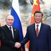 Chủ tịch Trung Quốc Tập Cận Bình (phải) và Tổng thống Nga Vladimir Putin tại cuộc gặp ở Bắc Kinh ngày 16/5/2024. (Ảnh: AFP/TTXVN)
