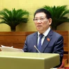 Bộ trưởng Bộ Tài chính Hồ Đức Phớc, thừa ủy quyền của Thủ tướng Chính phủ trình bày Báo cáo về công tác thực hành tiết kiệm, chống lãng phí năm 2023. (Ảnh: TTXVN)