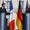 Tổng thống Pháp Emmanuel Macron (trái) và Tổng thống Đức Frank-Walter Steinmeier phát biểu trong cuộc họp báo chung sau cuộc hội đàm tại Dinh Tổng thống Bellevue ở Berlin, Đức ngày 26/5/2024. (Nguồn: AFP)