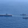 Tàu khu trục Aegis của Hàn Quốc, tàu sân bay Mỹ USS Carl Vinson và tàu khu trục lớp Kongo của Lực lượng Phòng vệ biển Nhật Bản tham gia cuộc tập trận chung ở vùng biển phía Nam Bán đảo Triều Tiên ngày 17/1/2024. (Ảnh: Yonhap/TTXVN)
