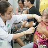 Tiêm vaccine cho trẻ tại Viện Pasteur Thành phố Hồ Chí Minh. (Ảnh: Phương Vy/TTXVN)