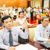 Các đại biểu biểu quyết thông qua Nghị quyết về kế hoạch đầu tư công năm 2025. (Nguồn: Đảng bộ Thành phố Hồ Chí Minh)