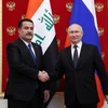 Tổng thống Nga Vladimir Putin và Thủ tướng Iraq Mohammed Shia Al-Sudani chụp ảnh trong một cuộc họp tại Moskva ngày 10/10/2023. (Ảnh: Reuters)