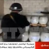 Các thanh sát viên của tổ chức OPCW kiểm tra tại một địa điểm chứa vũ khí hóa học của Syria. (Nguồn: AFP/TTXVN)