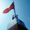Khánh thành cột cờ Tổ quốc tại đảo Trần, Quảng Ninh. (Ảnh: Nguyễn Hoàng/Vietnam+) 
