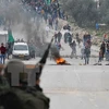 Đụng độ giữa người biểu tình Palestine và quân đội Israel. (Nguồn: AFP/TTXVN) 